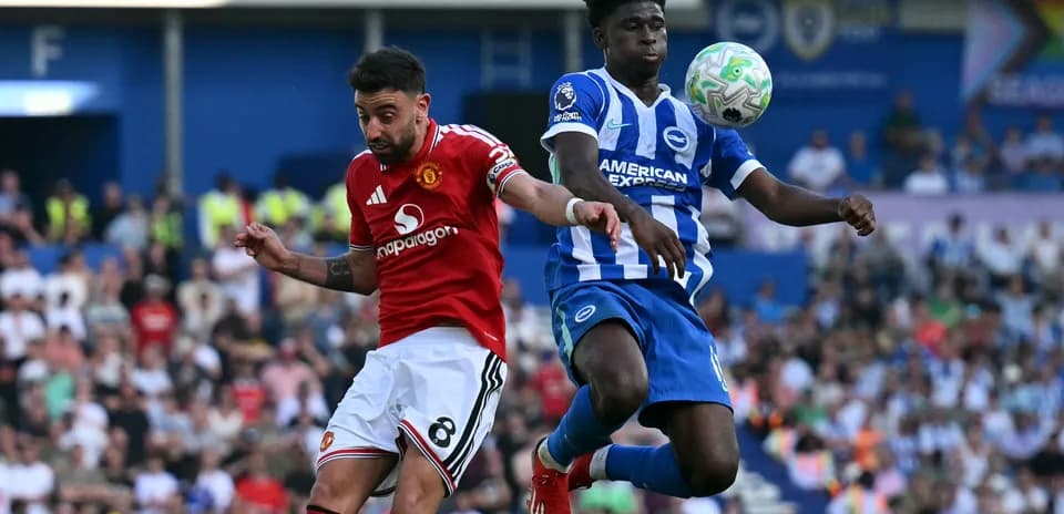Bruno Fernandes and defender challenging for the ball