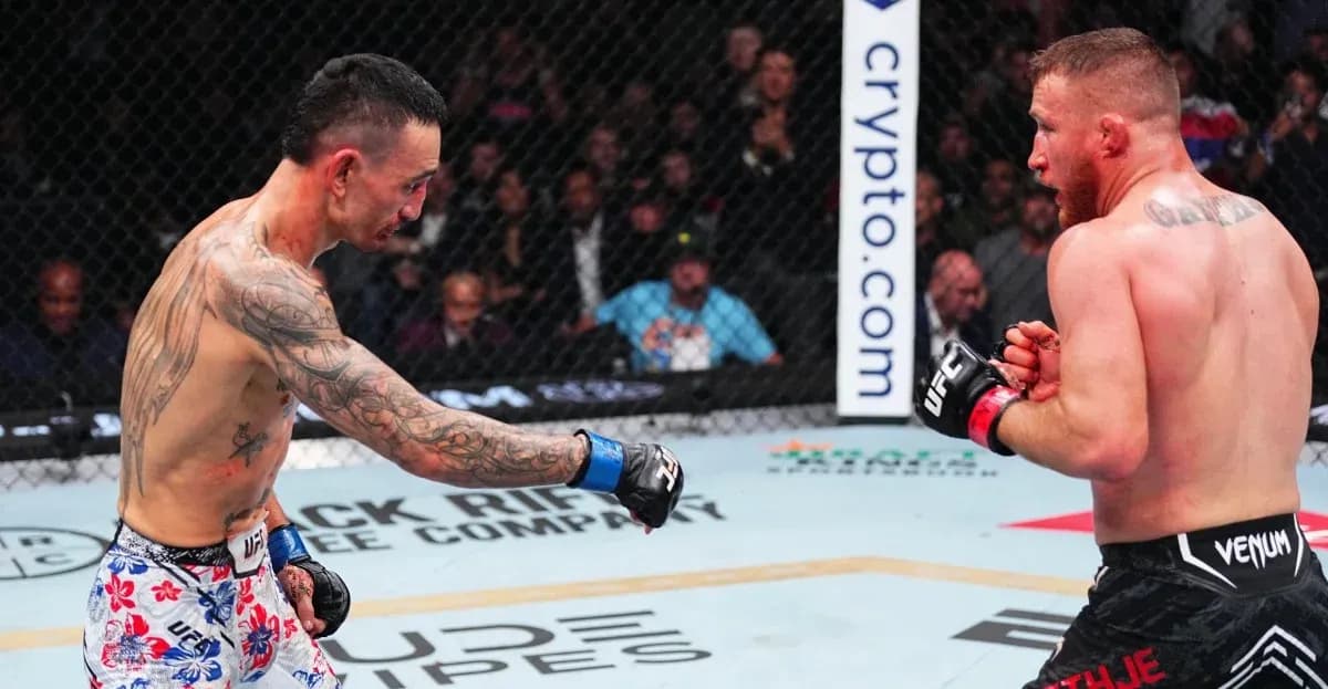 Two fighters engaging in a match inside the octagon