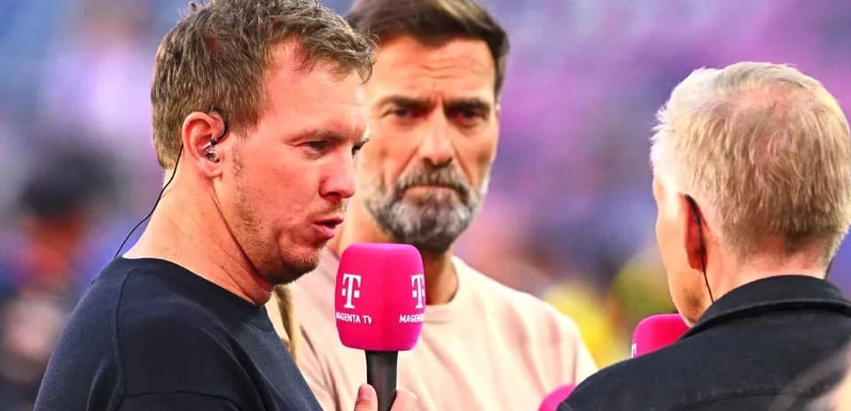 Interviewer speaking with guests before the match