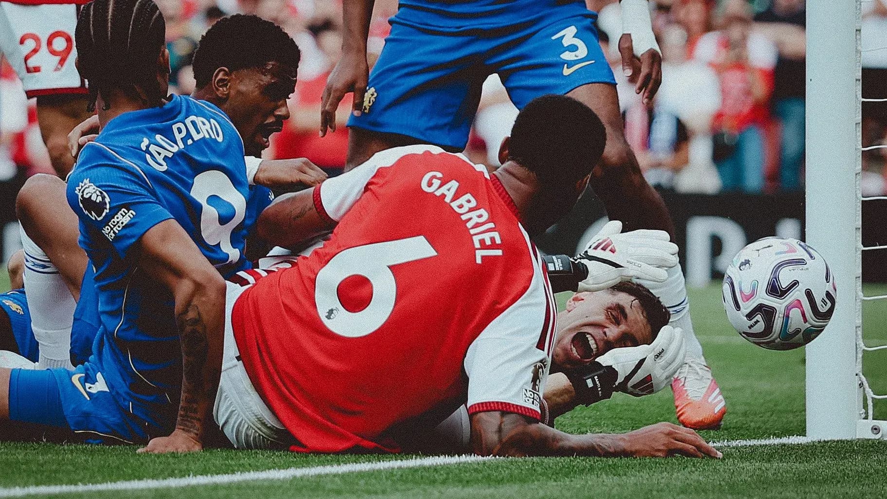 Players contesting near goal line during match