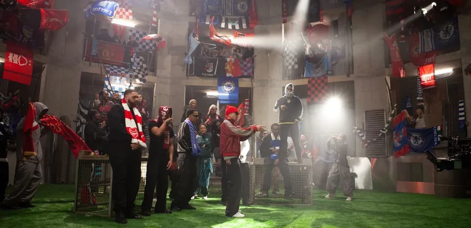 Fans in a venue with football team flags