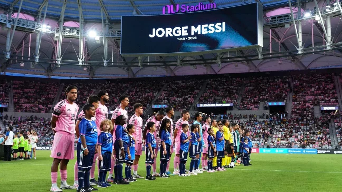 Players and children lined up before the match