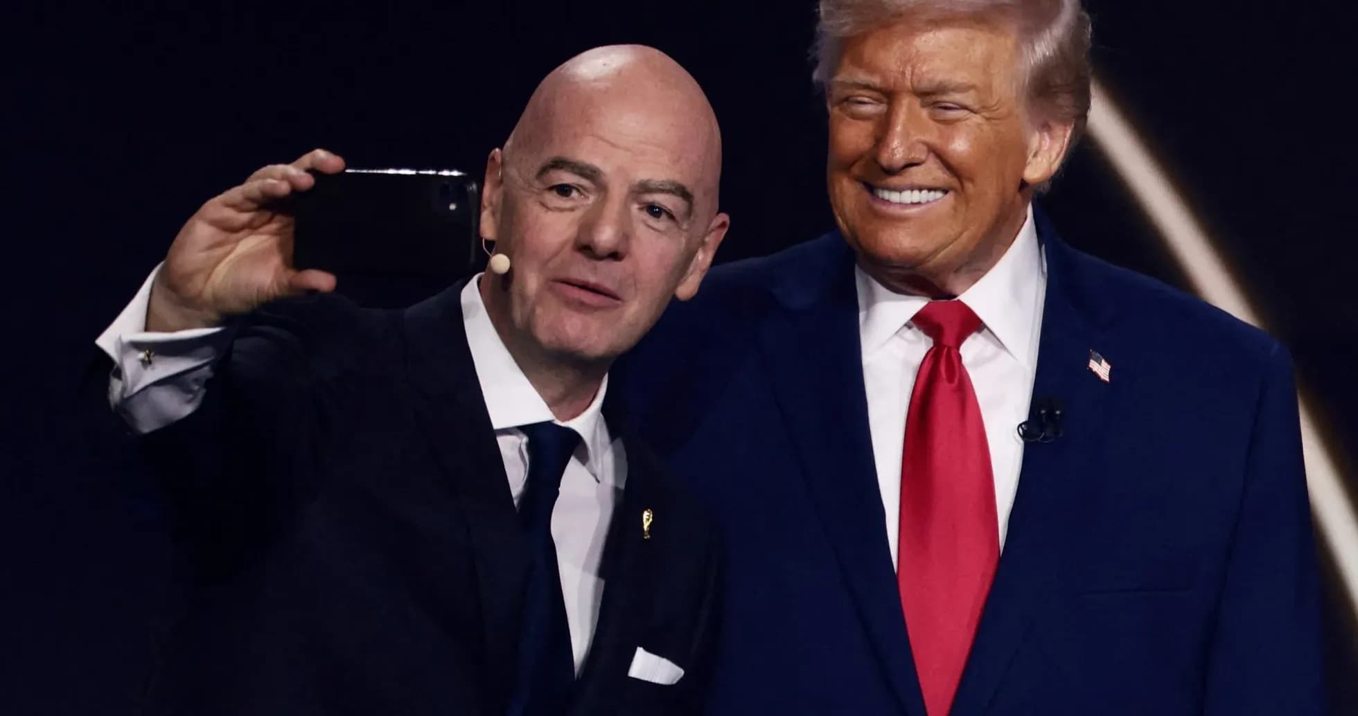 Two men taking a selfie on stage