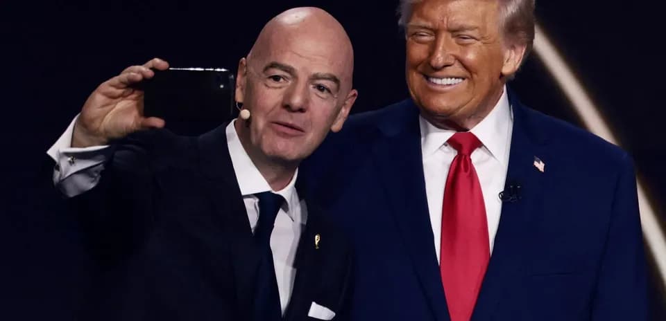Two men taking a selfie on stage
