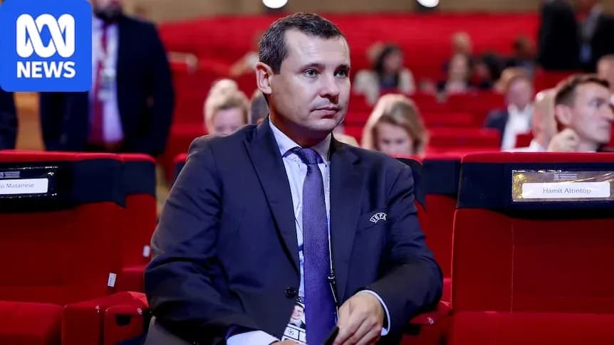 Man sitting in conference hall among attendees