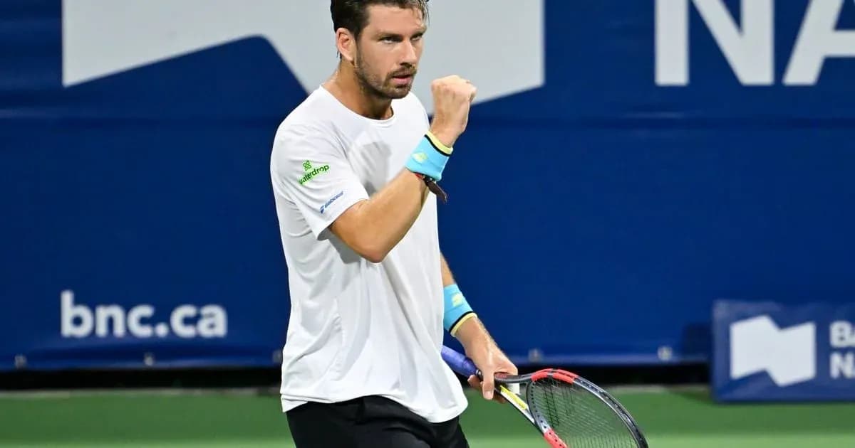 Tennis player celebrating with raised fist on court Tennis player celebrating with raised fist on court