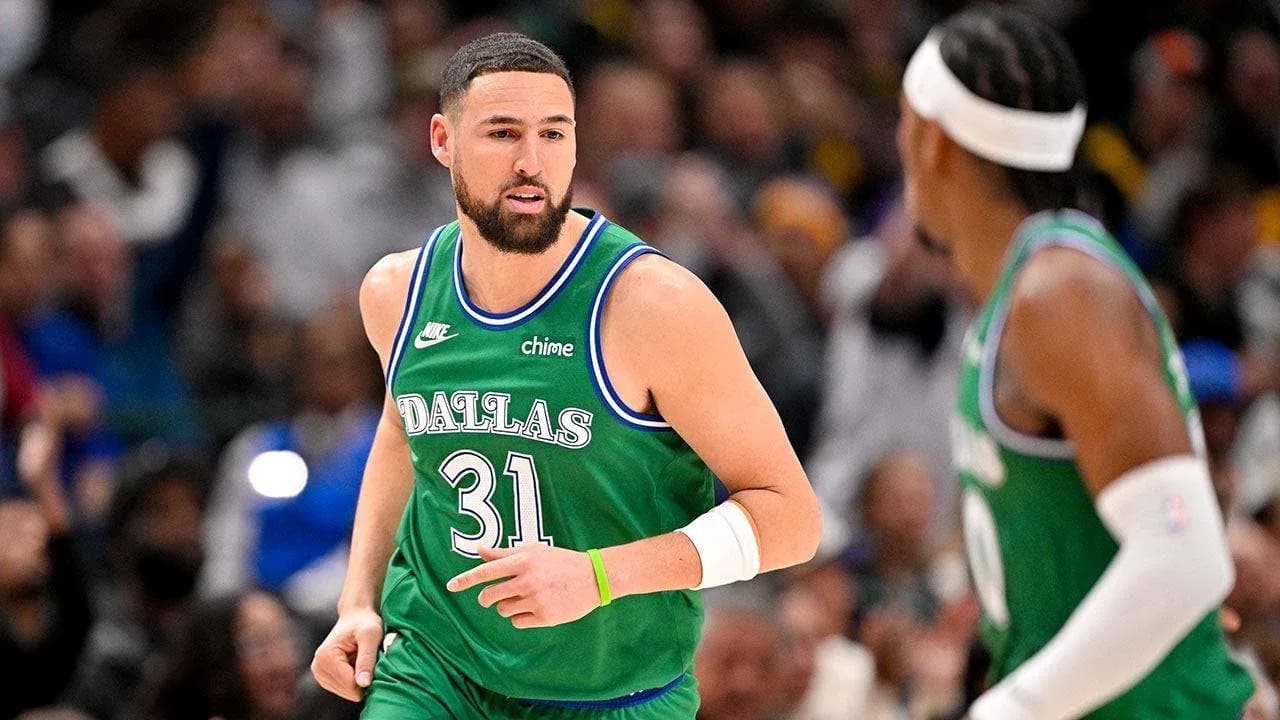 Basketball player in green Dallas jersey during game Basketball player in green Dallas jersey during game