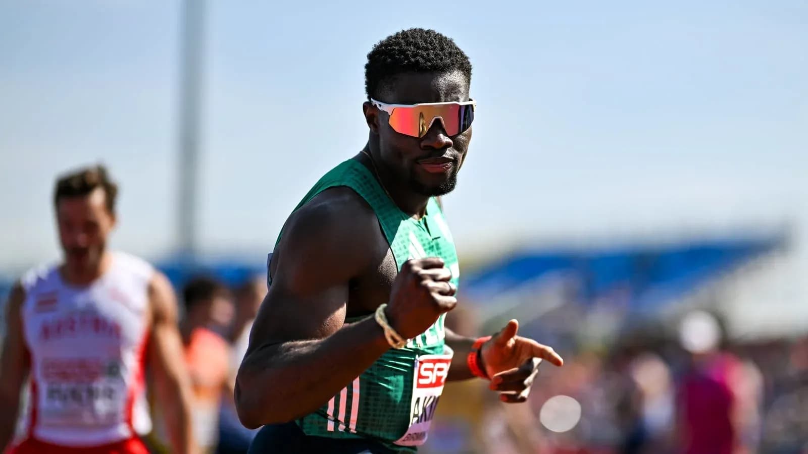 Athlete celebrating on track during competition Athlete celebrating on track during competition