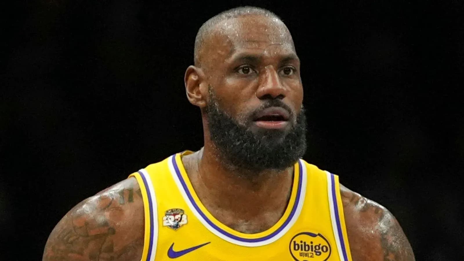 Basketball player in Lakers jersey during game Basketball player in Lakers jersey during game