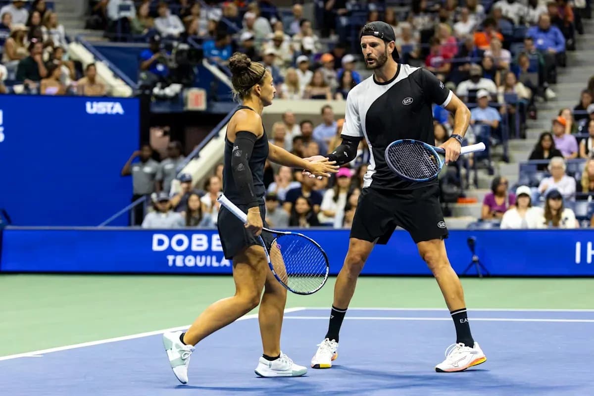 Tennis players exchanging a handshake on court Tennis players exchanging a handshake on court