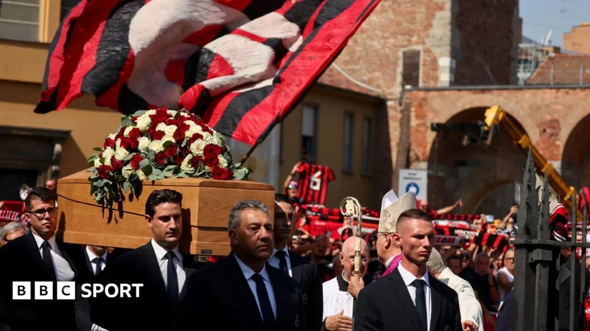 Funeral procession with coffin and supporters in attendance Funeral procession with coffin and supporters in attendance