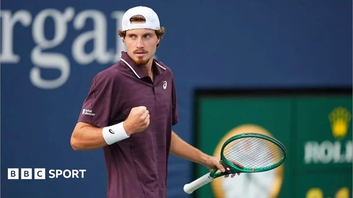 Tennis player celebrating with racket during match Tennis player celebrating with racket during match