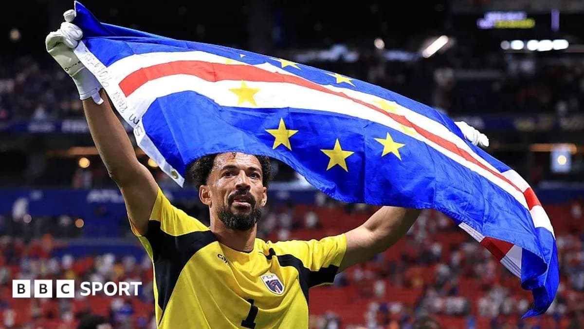 Goalkeeper celebrating with Cape Verde flag after match Goalkeeper celebrating with Cape Verde flag after match