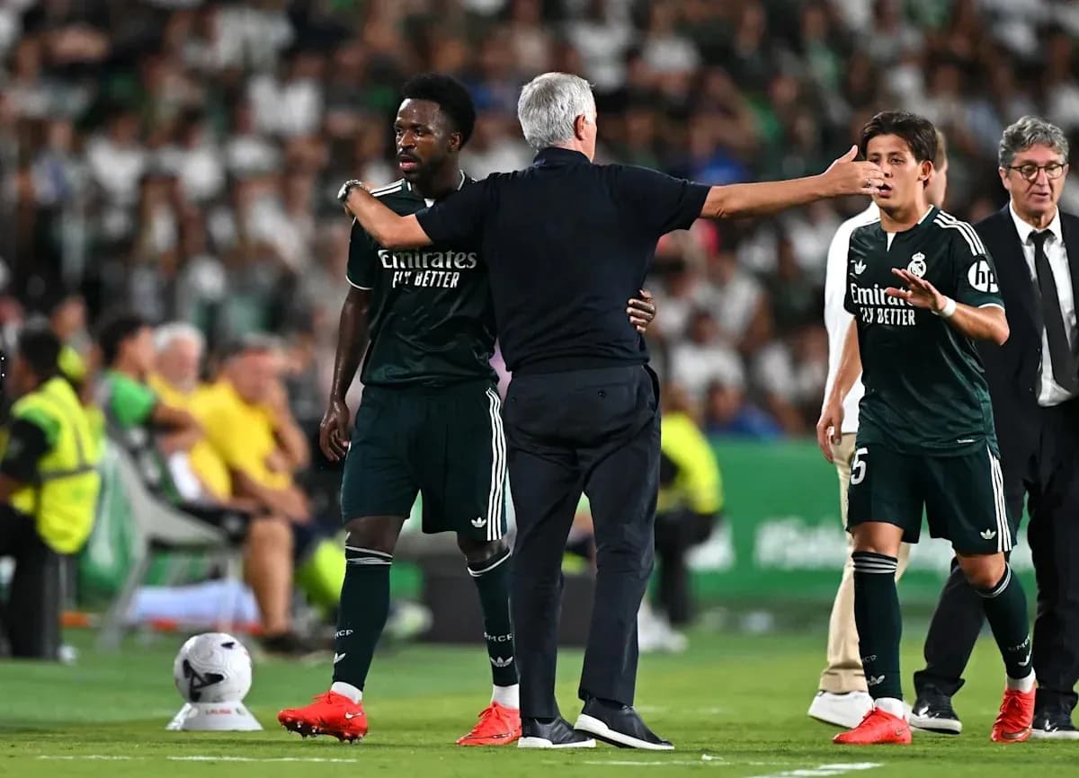 Real Madrid players interacting with coach during match Real Madrid players interacting with coach during match