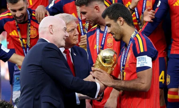 FIFA president presenting trophy to Spanish player FIFA president presenting trophy to Spanish player