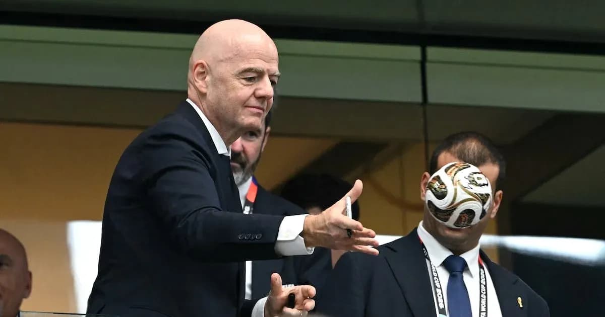 FIFA president Gianni Infantino tossing a football FIFA president Gianni Infantino tossing a football