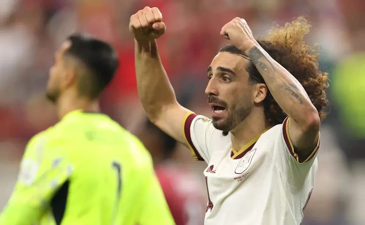 Player celebrating with raised fists during match Player celebrating with raised fists during match