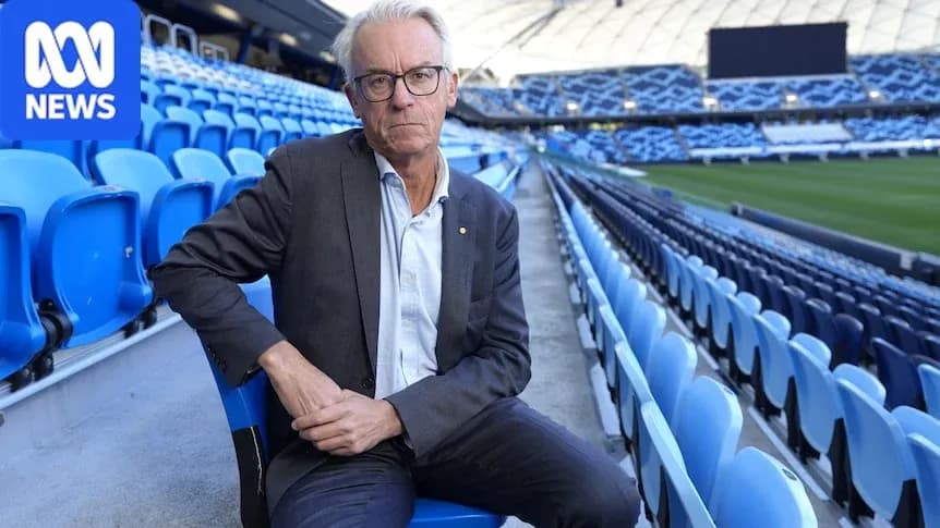 Man seated in empty stadium stands Man seated in empty stadium stands