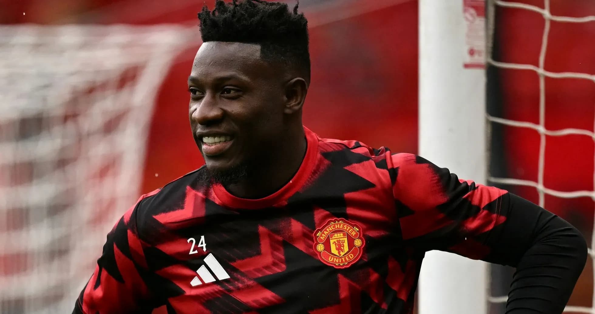 Manchester United goalkeeper smiling during warm-up Manchester United goalkeeper smiling during warm-up
