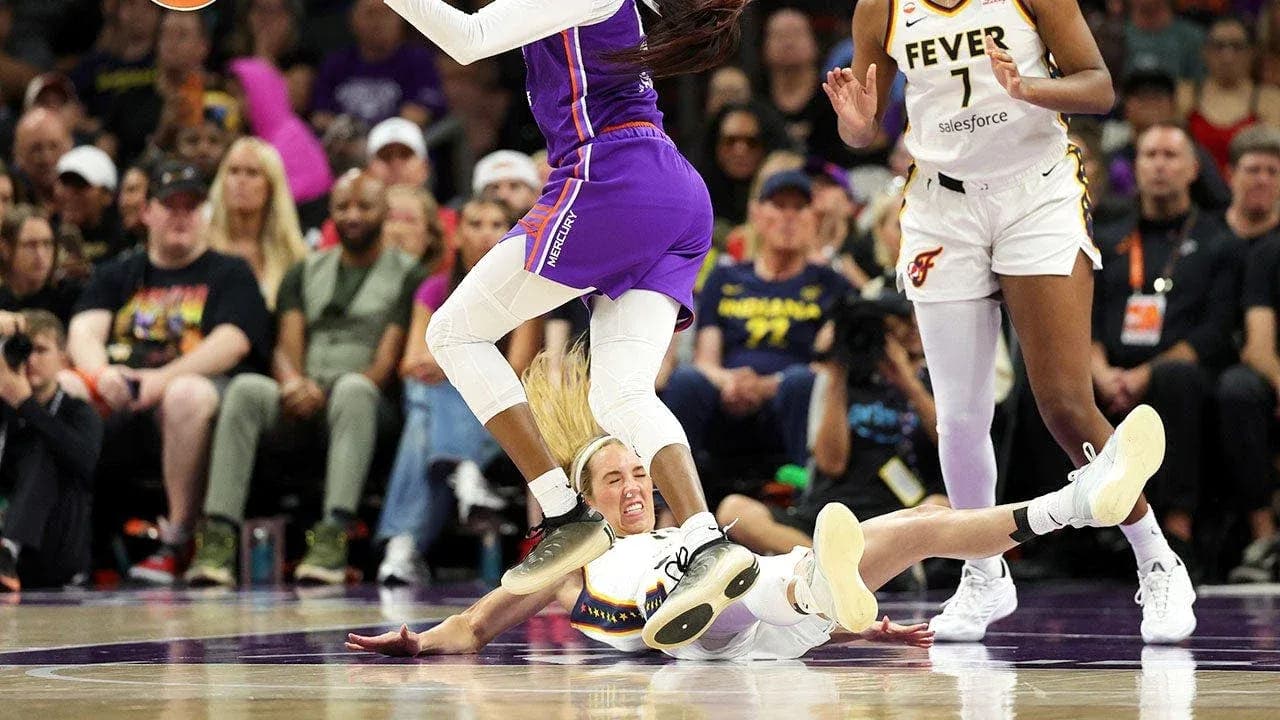 Basketball players competing for the ball on court Basketball players competing for the ball on court