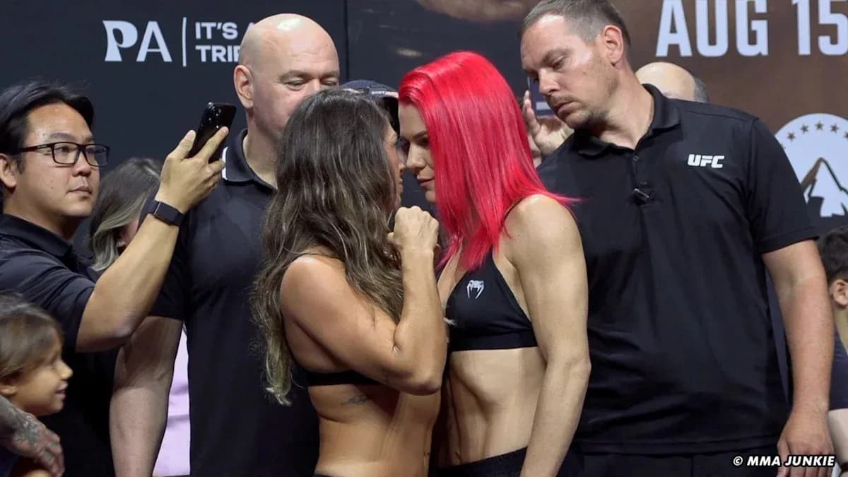 Two fighters facing off at weigh-in event Two fighters facing off at weigh-in event