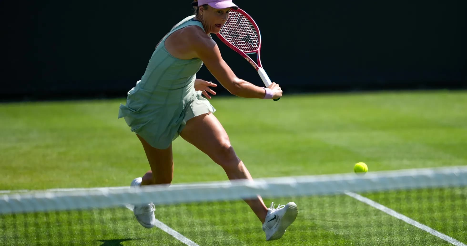 Tennis player hitting a ball during a match Tennis player hitting a ball during a match