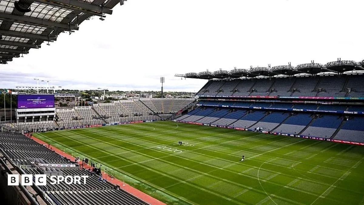Croke Park stadium with empty seats and green pitch Croke Park stadium with empty seats and green pitch