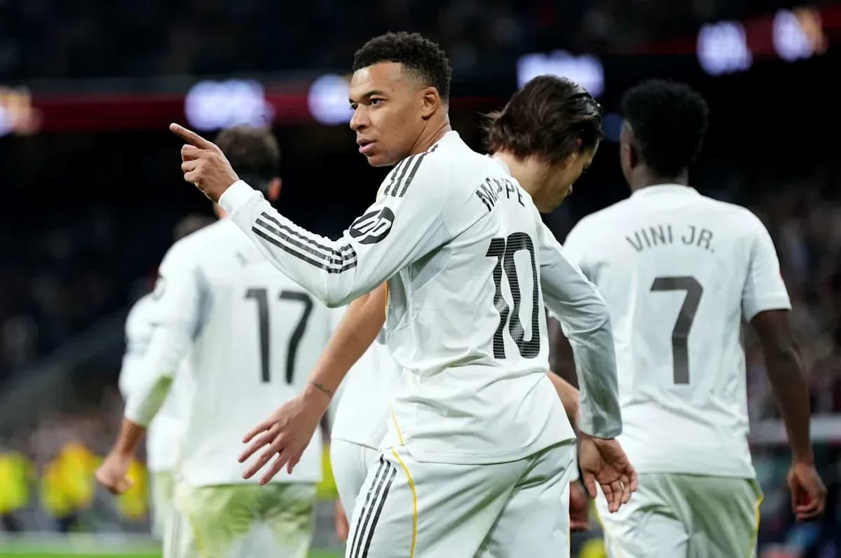 Mbappe celebrating with teammates after scoring goal Mbappe celebrating with teammates after scoring goal