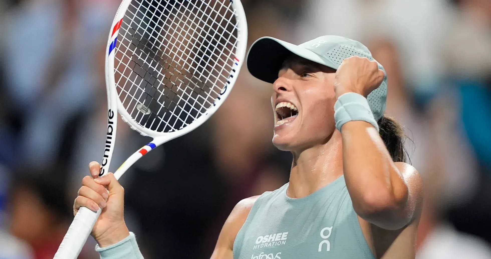 Tennis player celebrating victory with racket raised Tennis player celebrating victory with racket raised