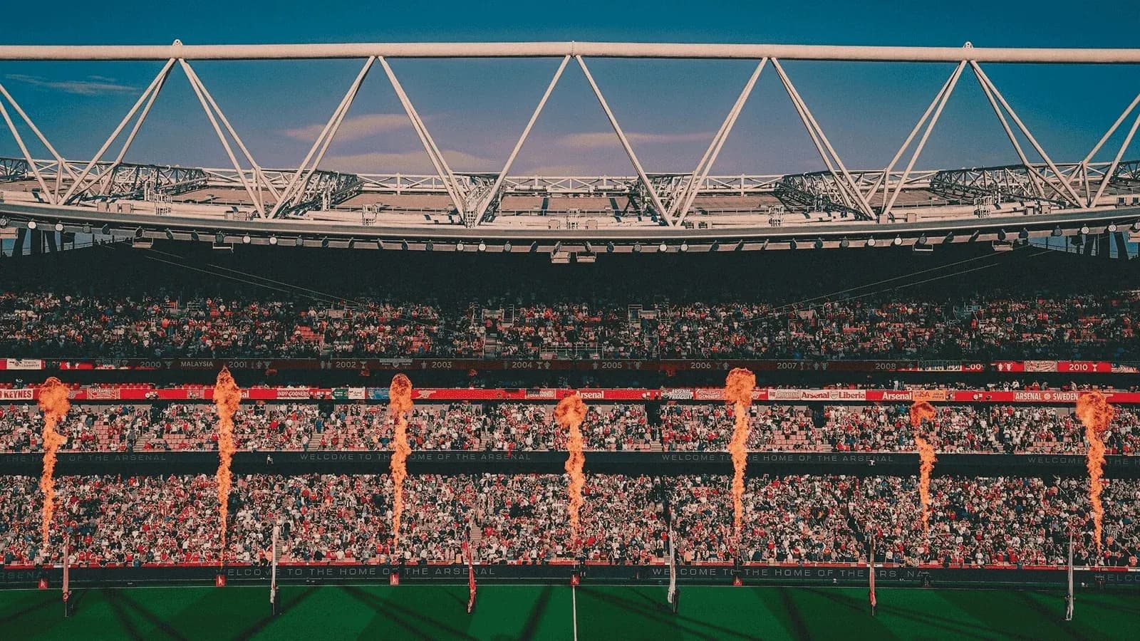 Stadium filled with fans and flame displays Stadium filled with fans and flame displays