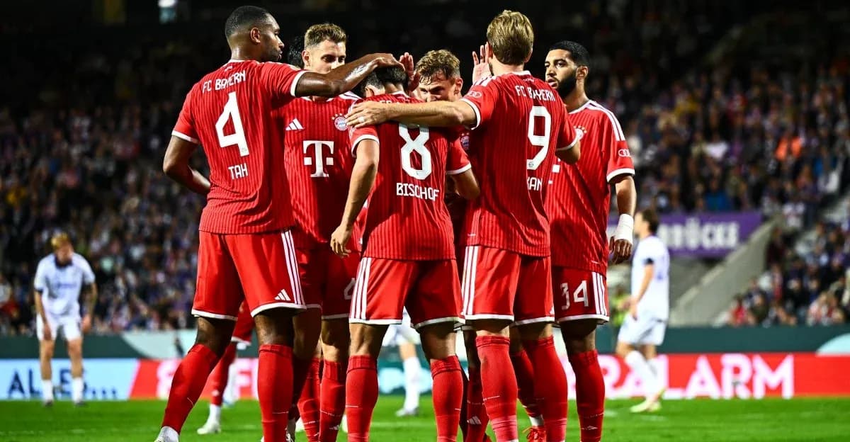 FC Bayern players celebrating a goal together FC Bayern players celebrating a goal together