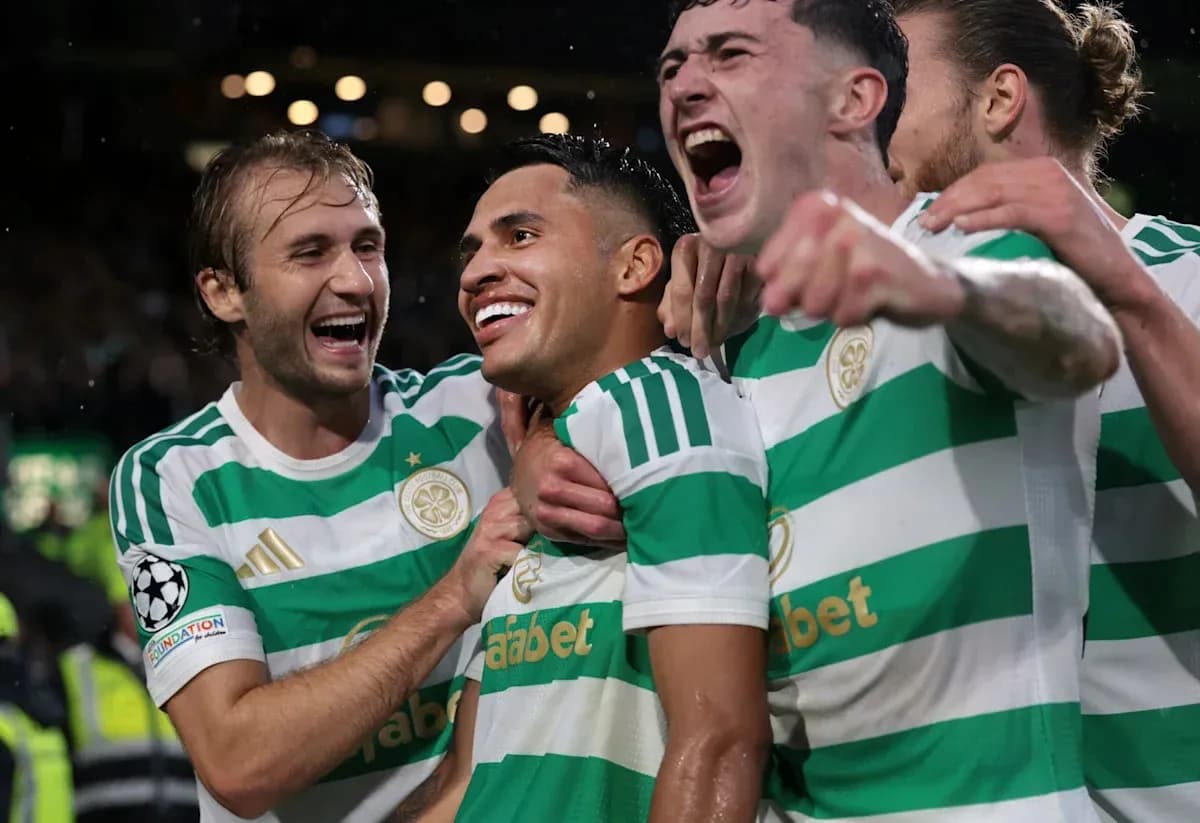 Celtic players celebrating a goal together Celtic players celebrating a goal together