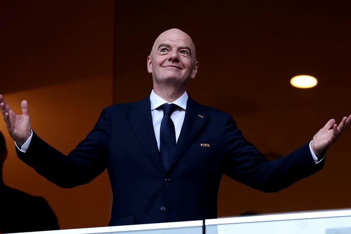 FIFA president gesturing from a VIP box FIFA president gesturing from a VIP box