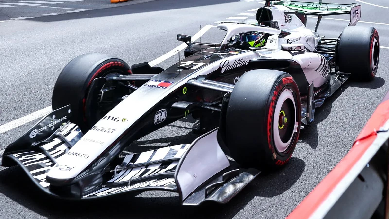 Formula 1 car on track during practice session Formula 1 car on track during practice session