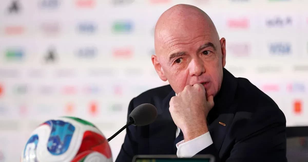 FIFA president at press conference with football FIFA president at press conference with football