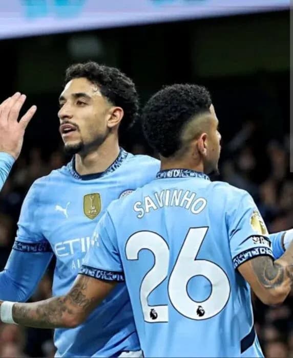 Manchester City players celebrating during a match Manchester City players celebrating during a match