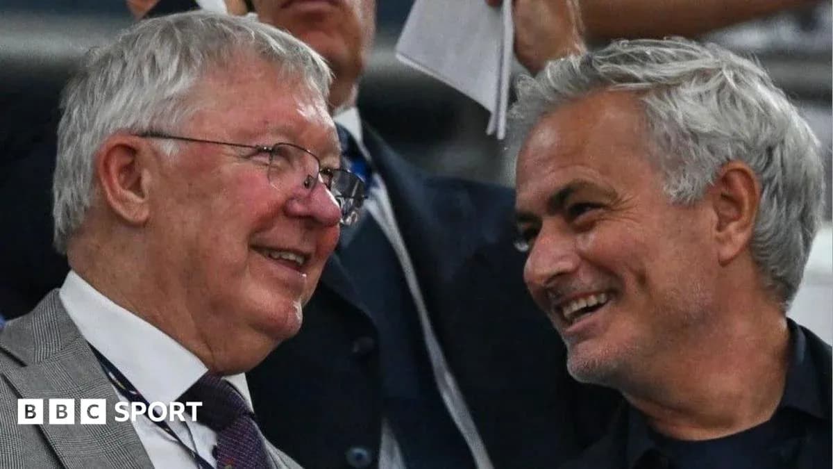 Two men smiling and talking in a stadium Two men smiling and talking in a stadium