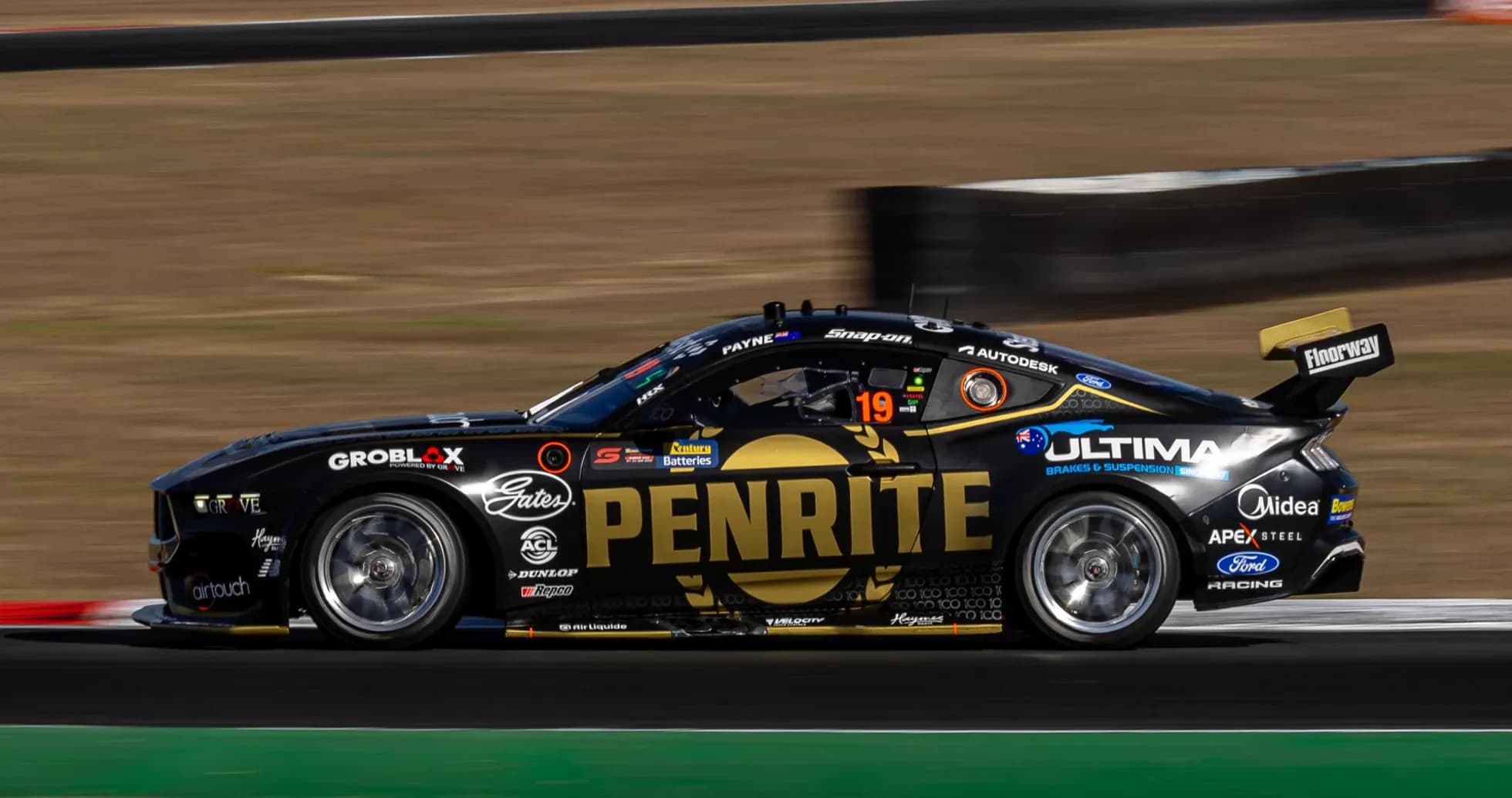 Penrite Racing car speeding on racetrack Penrite Racing car speeding on racetrack