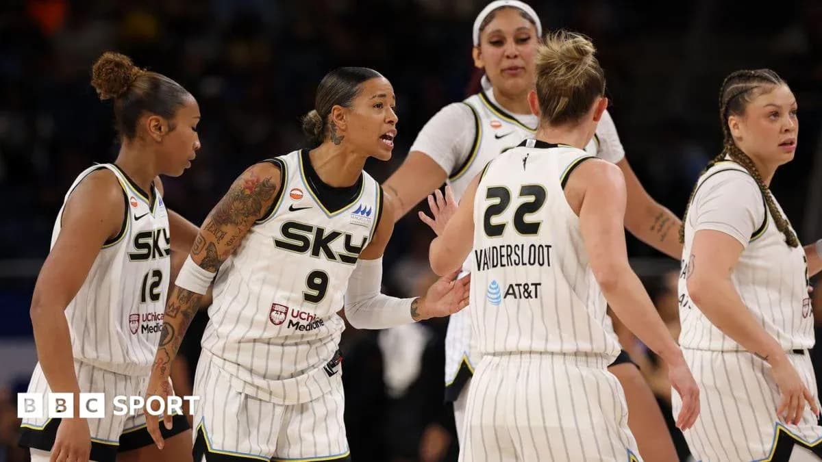 Chicago Sky players discussing strategy during game Chicago Sky players discussing strategy during game