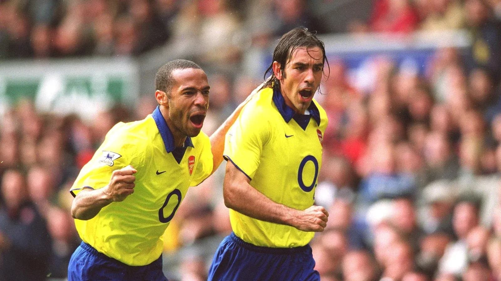 Arsenal players celebrating a goal on the pitch Arsenal players celebrating a goal on the pitch