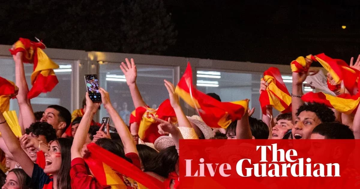 Fans celebrating with flags during an event Fans celebrating with flags during an event