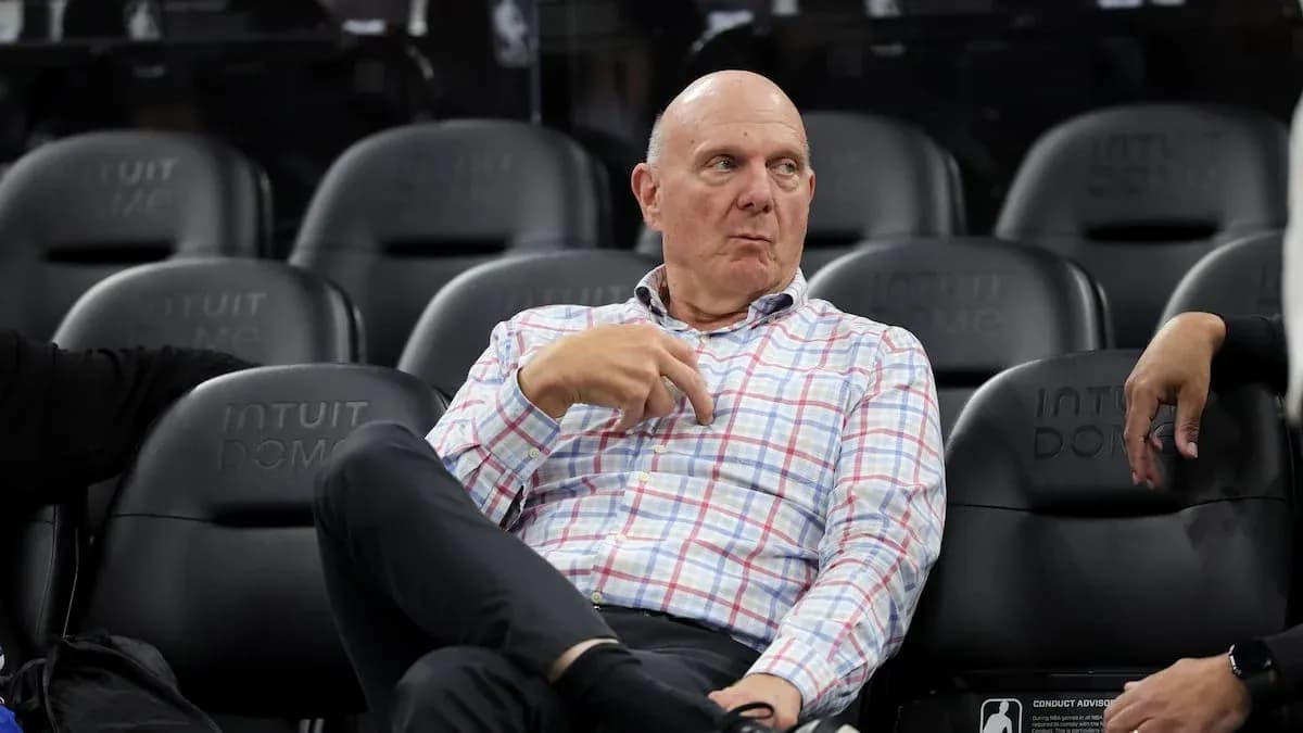 Man sitting in arena seats during event Man sitting in arena seats during event