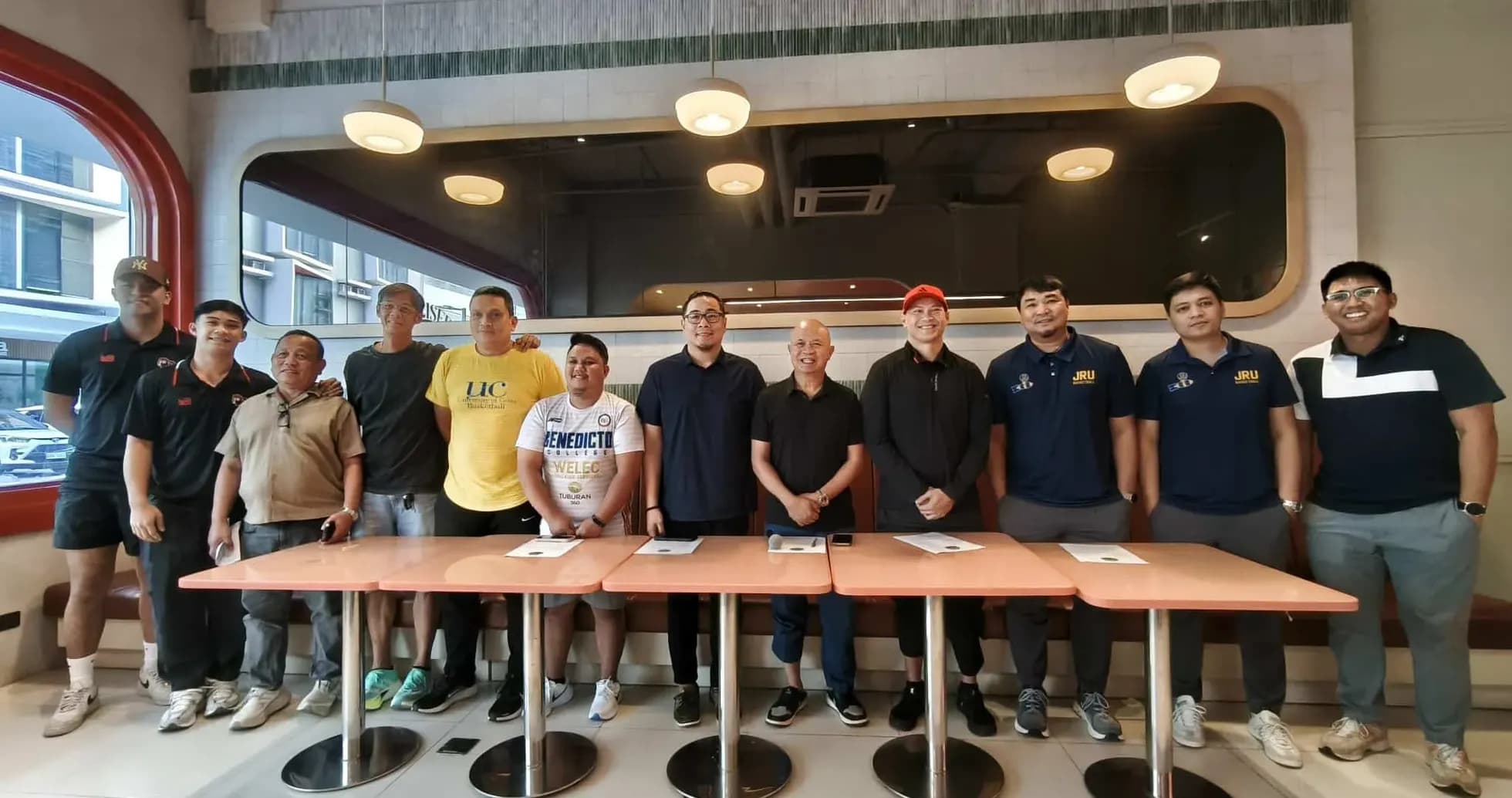 Group of people posing at a restaurant table Group of people posing at a restaurant table