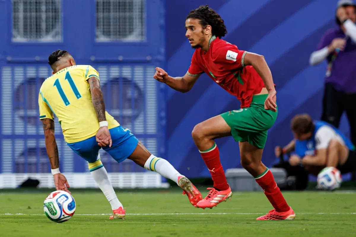 Brazilian player dribbling past Moroccan defender during match Brazilian player dribbling past Moroccan defender during match