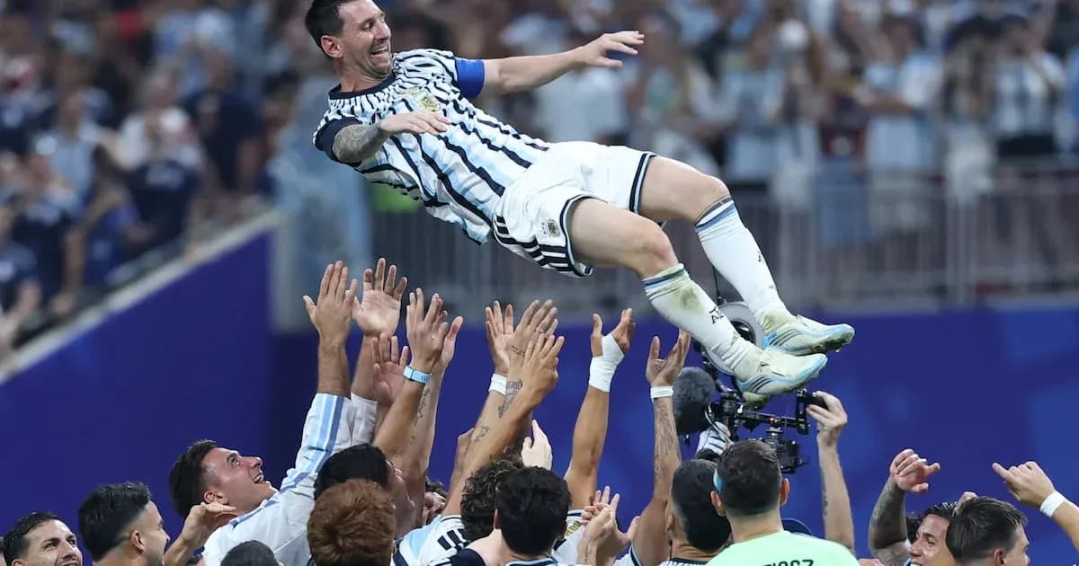 Lionel Messi celebrated by teammates after victory Lionel Messi celebrated by teammates after victory