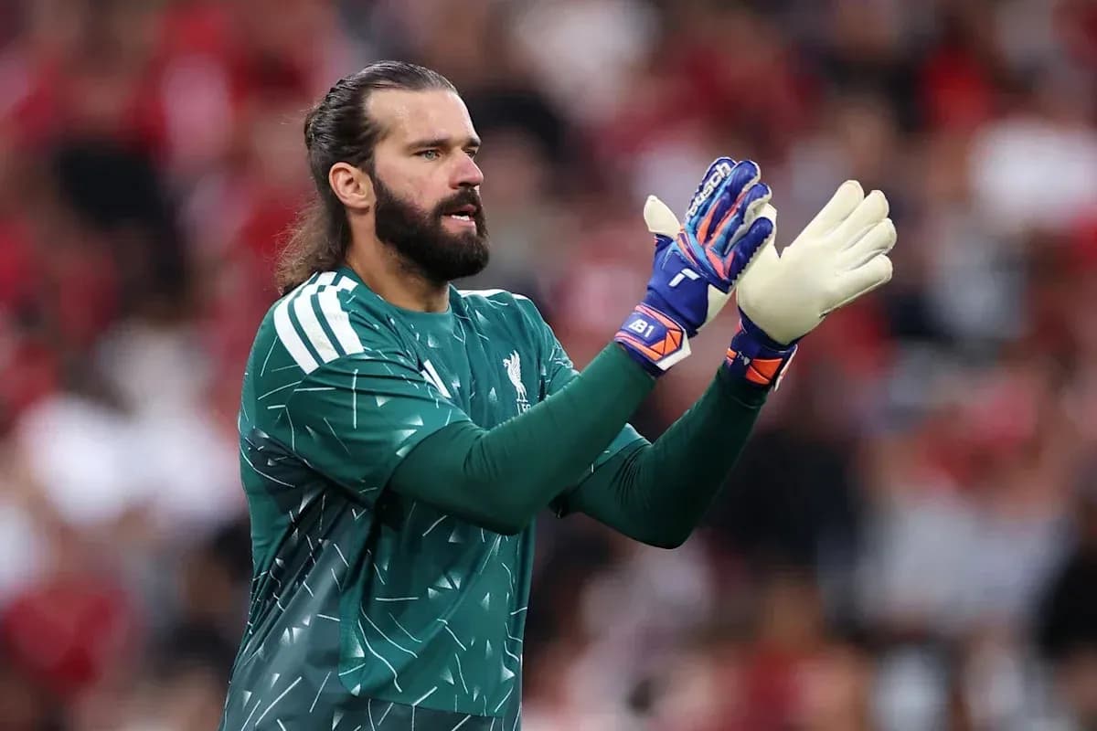 Goalkeeper in green kit clapping during match Goalkeeper in green kit clapping during match