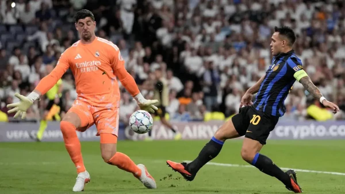 Goalkeeper attempting to save shot from striker Goalkeeper attempting to save shot from striker