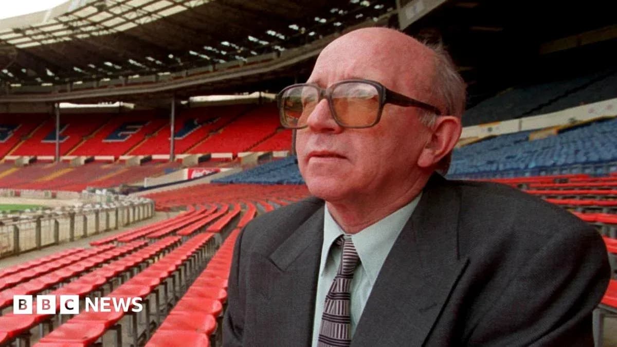 Man in glasses sitting in empty stadium stands Man in glasses sitting in empty stadium stands