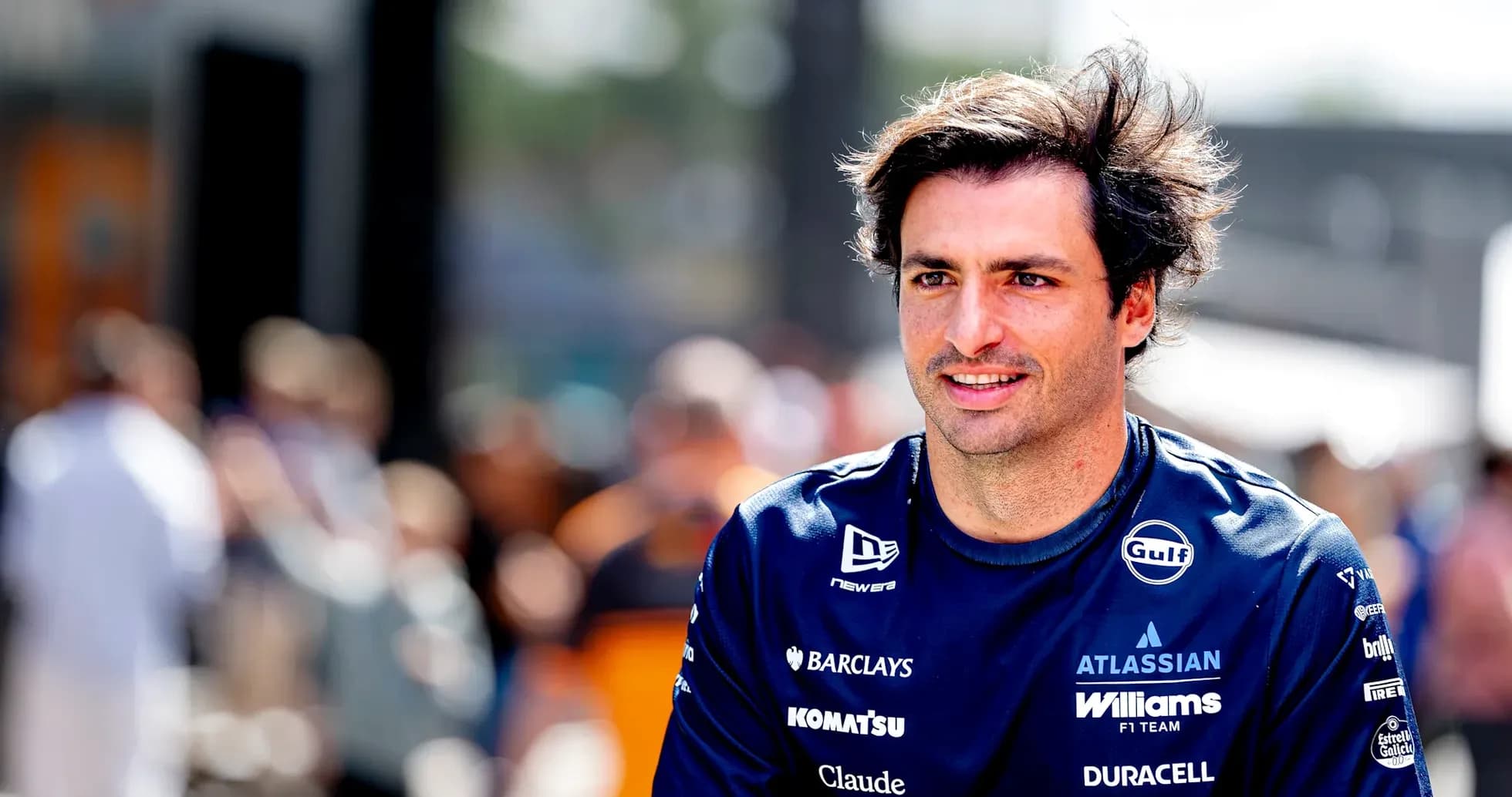 Formula 1 driver walking in team uniform Formula 1 driver walking in team uniform