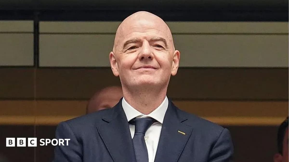 FIFA president attending an event, smiling FIFA president attending an event, smiling